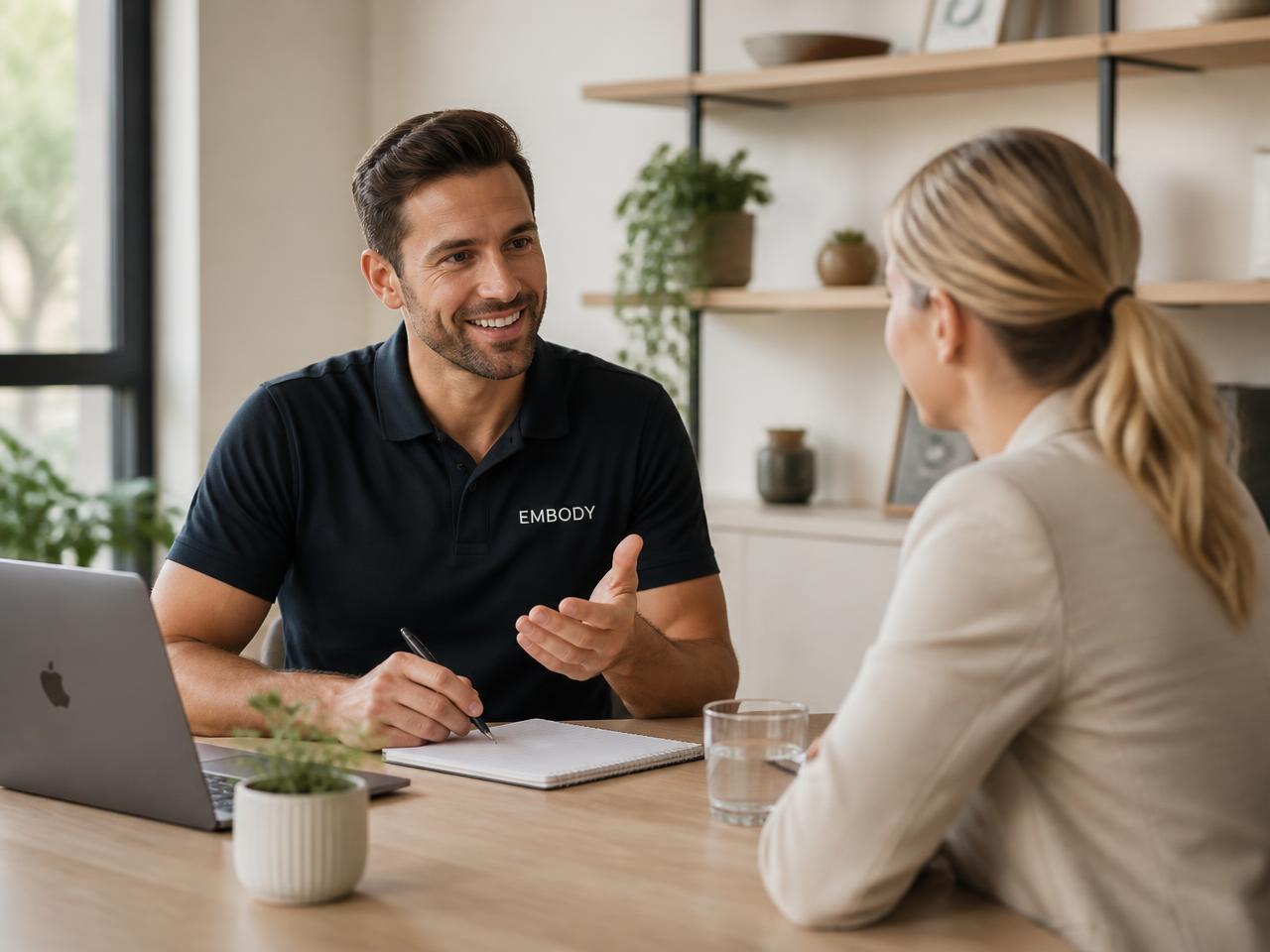 A coach reviewing a personalized training and nutrition plan with a client